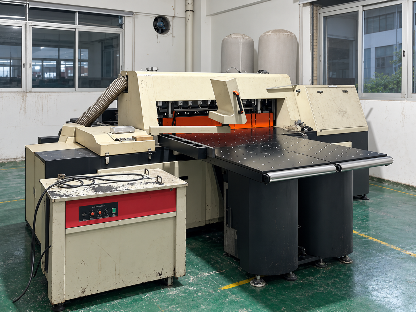Retouched photograph of workshop sheet processing equipment